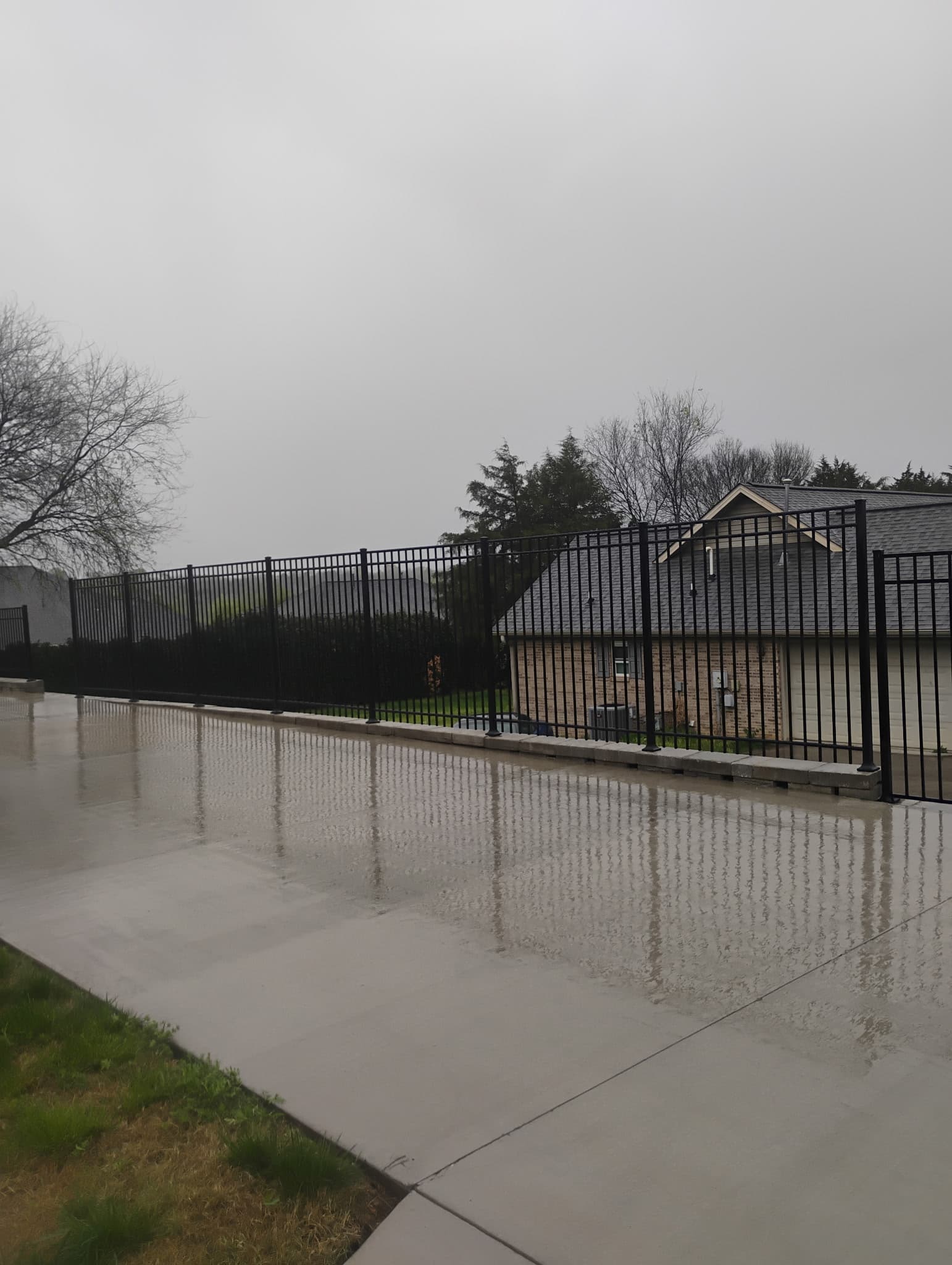 Aluminum fence installation around residential property