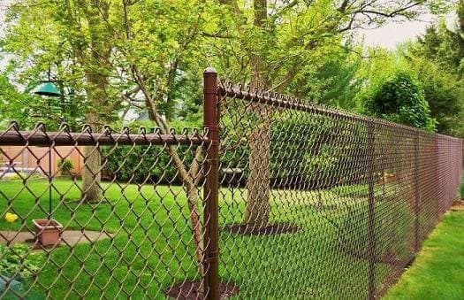 Brown vinyl coated chain-link residential fence - Model 505