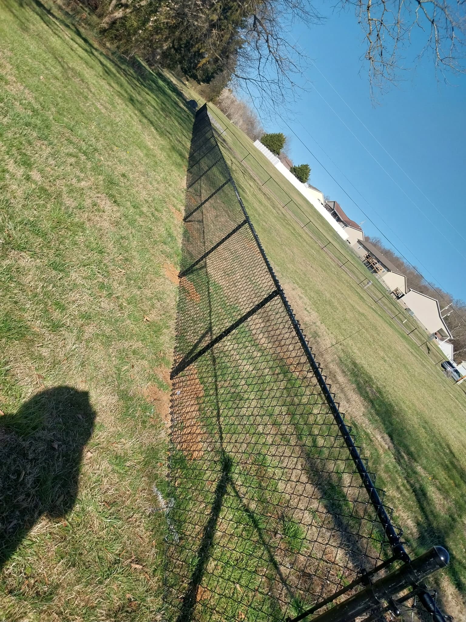 Galvanized chain-link fence installation