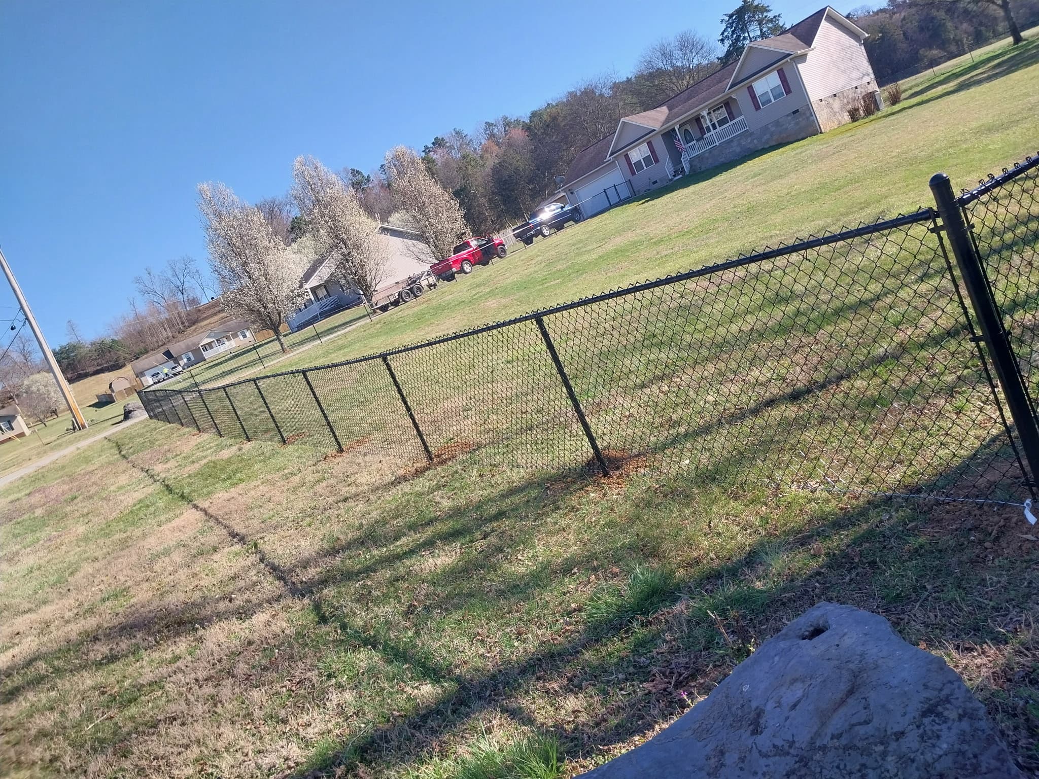 Black vinyl-coated chain-link fence