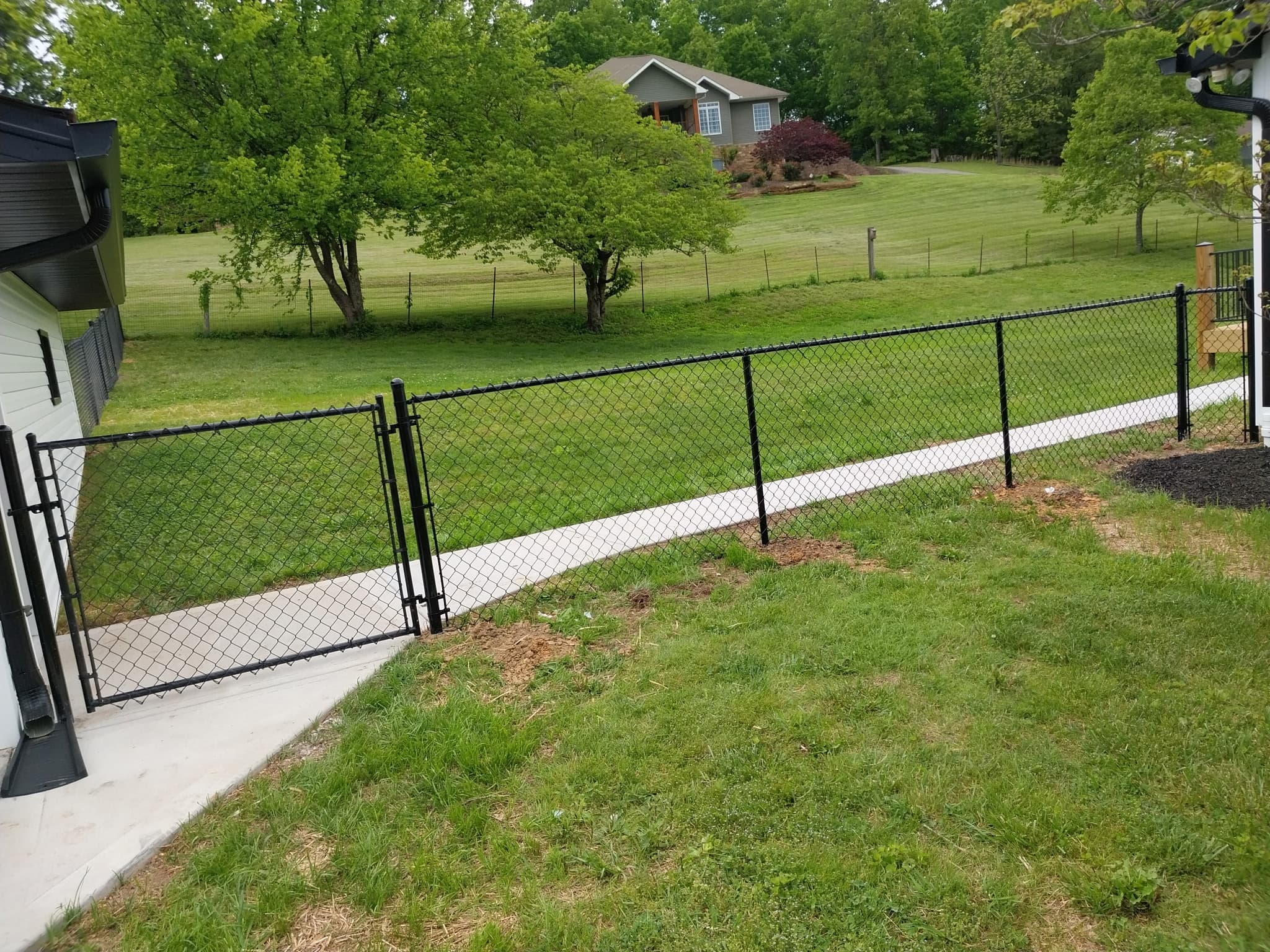 Chain-link fence with vinyl coating installation