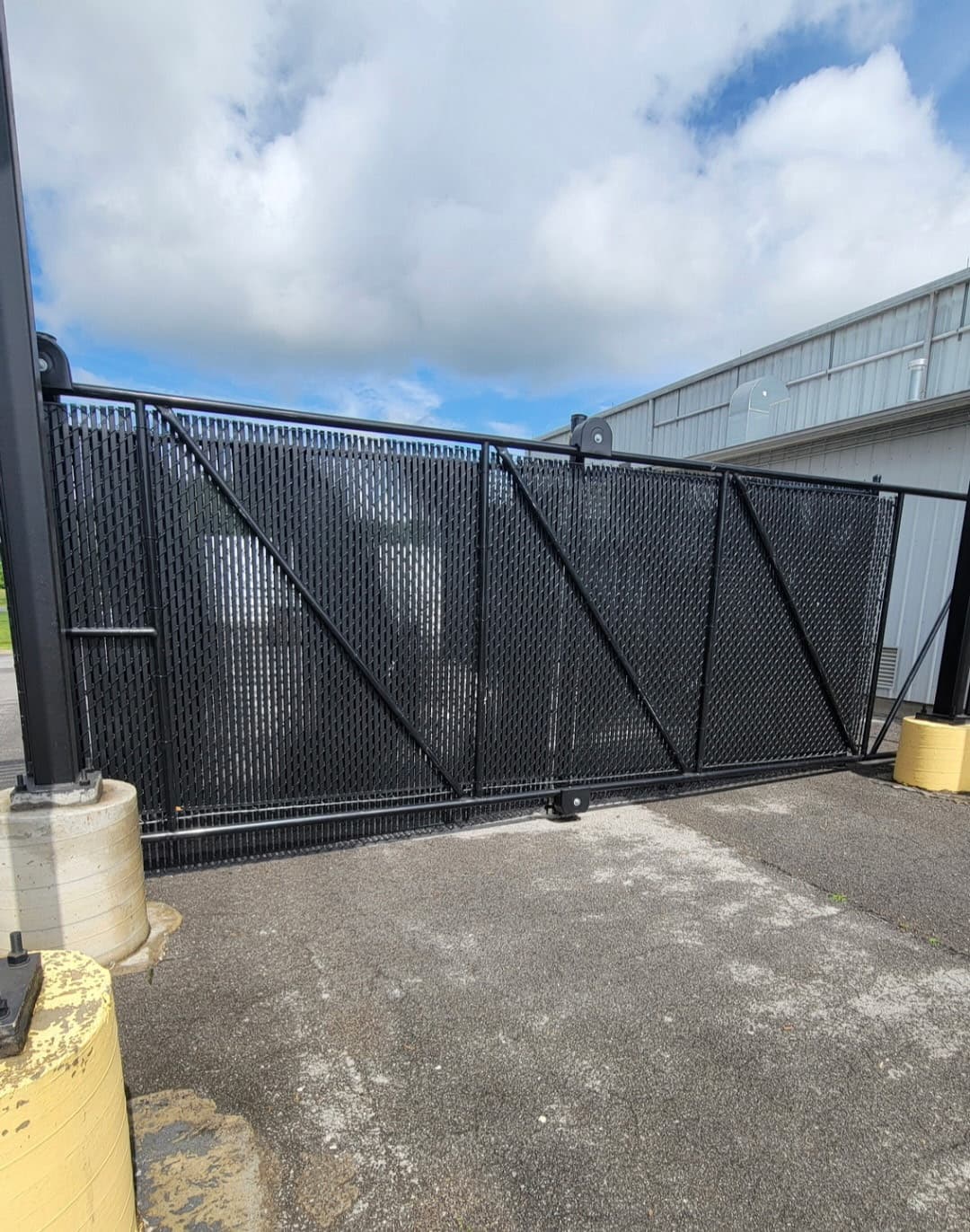 Black chain link cantilever slide gate