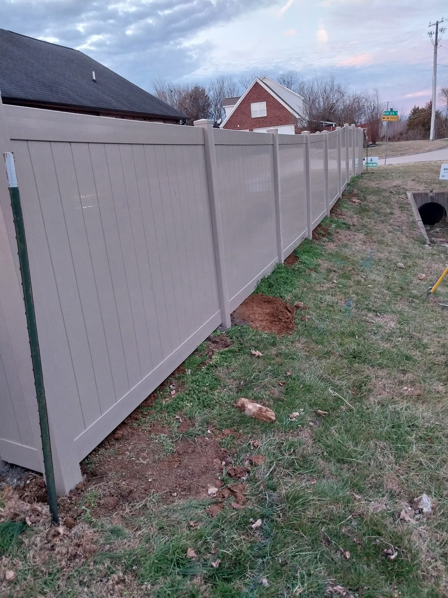 Vinyl spaced picket fence installation
